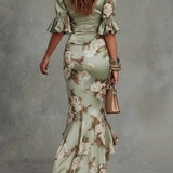 Anna - Asymmetrical long dress in green satin with V-neck, flared puff sleeves, and floral pattern