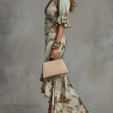 Anna - Asymmetrical long dress in green satin with V-neck, flared puff sleeves, and floral pattern